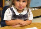 PK3 student Paislee Falgoust sorts her bears by color for the correct buses. Learning Fun For PK3 Students At SPC