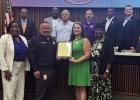 Dr. Sarina Lirette, Director of Adult Education at River Parishes Community College, accepts a Resolution from the St. James Parish Council proclaiming September as National Adult Education and Family Literacy Month.
