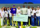 Representative Ken Brass presented a $275,000 check to Superintendent Chris Kimball and Lutcher Head Coach/Athletic Director Dwain Jenkins and St. James Head Coach/Athletic Director LaVanta Davis and the money will be used to help fund athletic programs a