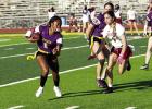 Bailyn Wingate, who is Lutcher’s quarterback, runs a QB keeper against Destrehan. The Bulldogs beat Destrehan 19-14. Photo by Tony Schexnayder