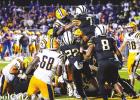 Lutcher quarterback D’Wayne Winfield could not be stopped last Friday. The junior play caller scored five rushing TDs and led the Bulldogs to their first victory over the St. James Wildcats in four years. Photo by Oliver Hooker “Lunchtime” – Lutcher Quarterback Serves Up Much Needed Victory Over Rival Wildcats