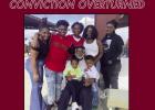 Keith Ezidore, pictured seated at the center, recently had his 1993 second-degree murder conviction overturned by the Louisiana Fifth Circuit Court of Appeal.