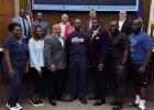 Several volunteers with the Vacherie Rams youth football organization take a photo with St. James Parish President Pete Dufresne and the Parish Council. The Parish has agreed to provide funding to help defray the cost of football equipment.
