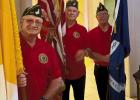 American Legion Post 171 members Timmy Roussel, Tommy Schexnayder and Kerry Melancon prepare to post the Flags to help start the Patriotic Mass in honor of America turning 250-years old on July 4, 2026.