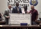 The St. James Parish School Board recognized and thanked Representative Ken Brass for securing funds used to support the District’s intern program, cosmetology program, and high school athletics. Pictured above are Rep. Brass presenting a $275,000 check