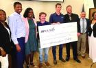 Representatives of D. E. Shaw Renewable Investments (DESRI) present a check in the amount of $1100,000 to the St. James School District. The finds will be used to support St. James High, the Salute 1st mentoring program at SJH and 6th Ward Elem., Wildcat Local Industries Make Hefty Donation In Effort To Invest In West Bank Schools, Students And Community