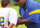 Lionel “Luke” Harry doing what he loved to do - coaching and mentoring the youth of his community St. James High To Honor Lionel “Luke” Harry And Retire Chad Jasmin’s Number