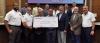 ExxonMobil representative Michael Smith and other company officials presented a $66,000 check to the St. James Parish Council last week representing the cost of hand-held carbon dioxide monitors to be used by the St. James Parish Sheriff's Office. The mon